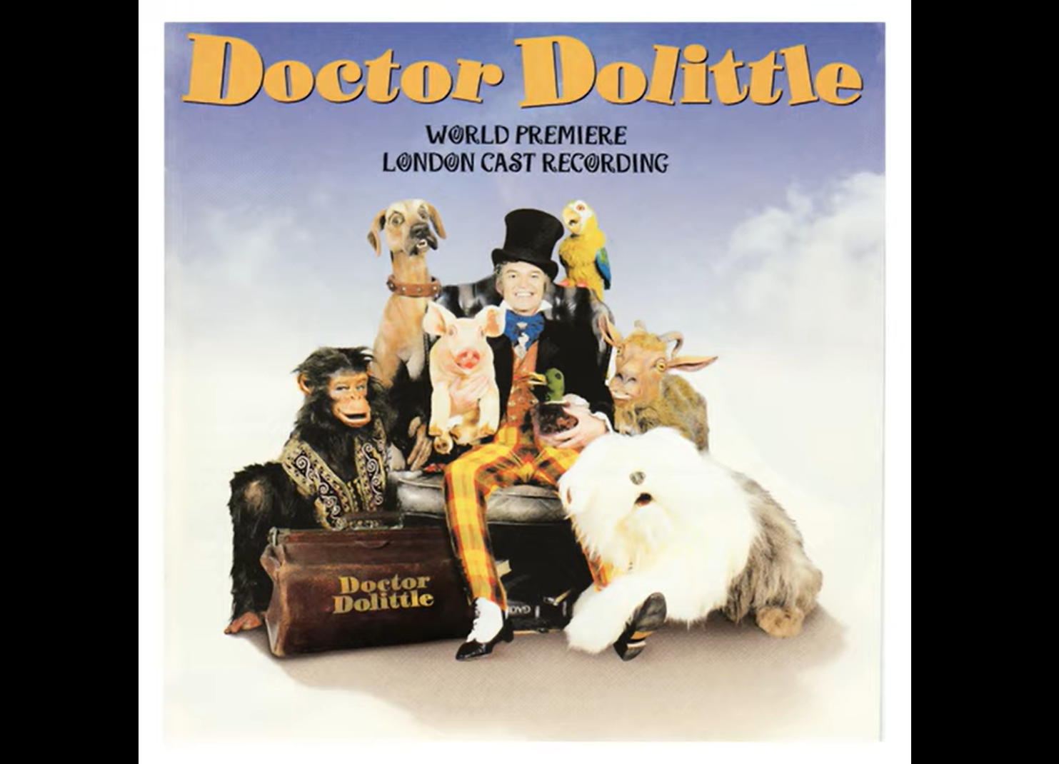 Movie poster of Doctor Dolittle with him and various animals around.